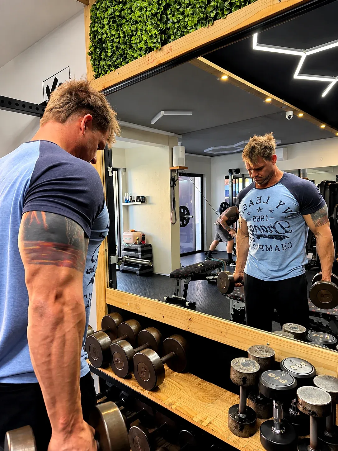 The XO Fit gym: man at the dumbbells