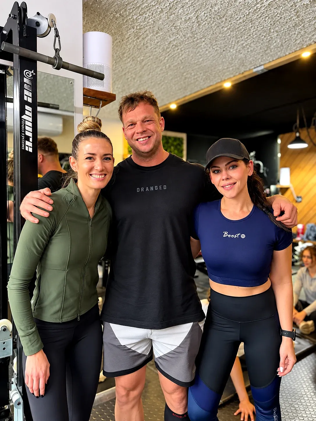 The XO Fit gym: three people smiling